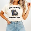 Raccoon Siting Sofa Screaming Is Self Care T-Shirt