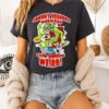 Johnny Voodoo’s Barber Shop Get A Cut N’ Hippin’ Keepin’ Barbering Weird Zombie Goat Cartoon T-Shirt